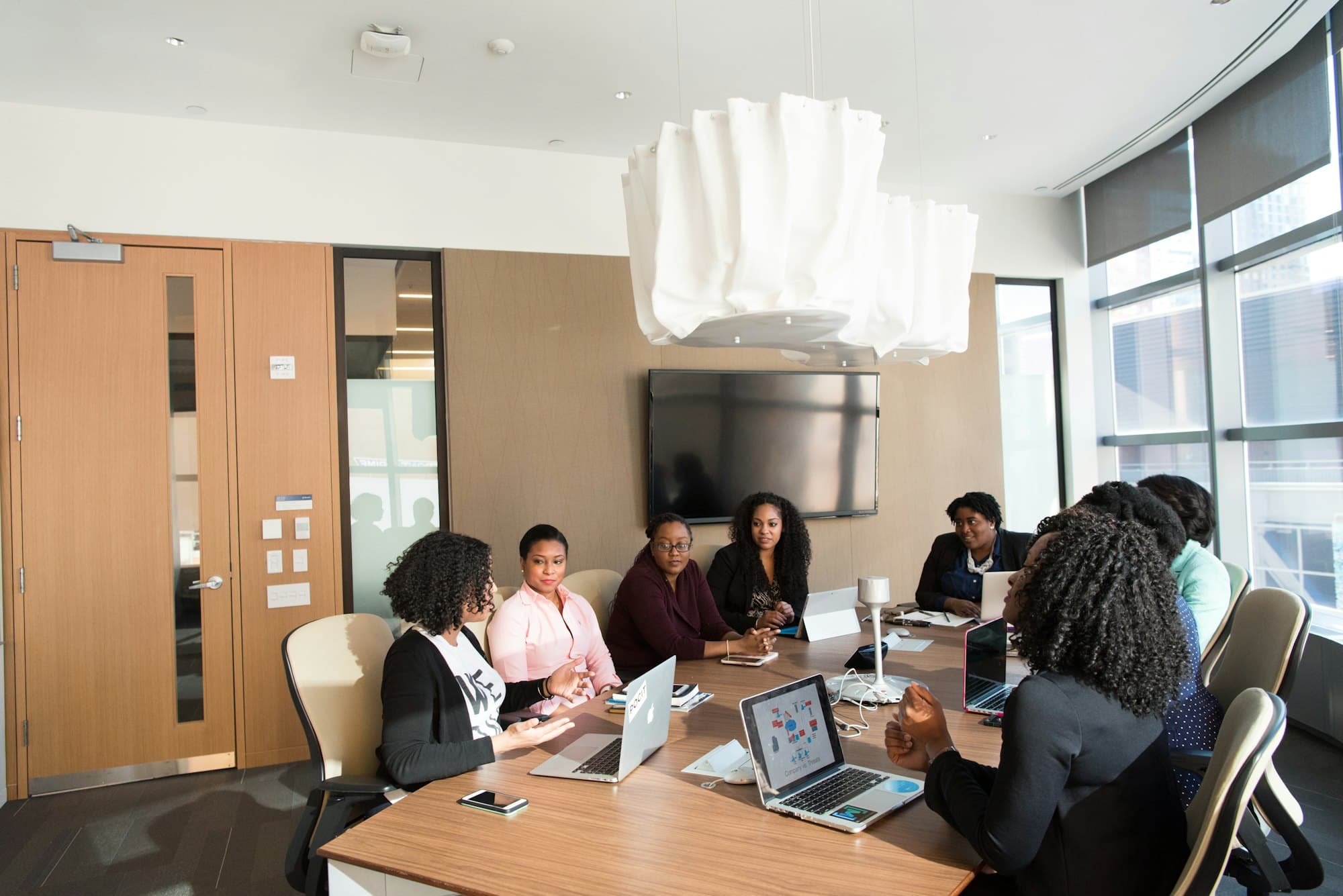 A board meeting in progress around a table